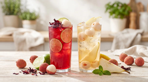 Lychee and hibiscus cold brew iced teas with fresh fruit - no added sugar